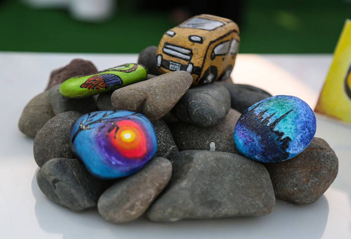 Painting stones with kids — cheerful, colorful stones